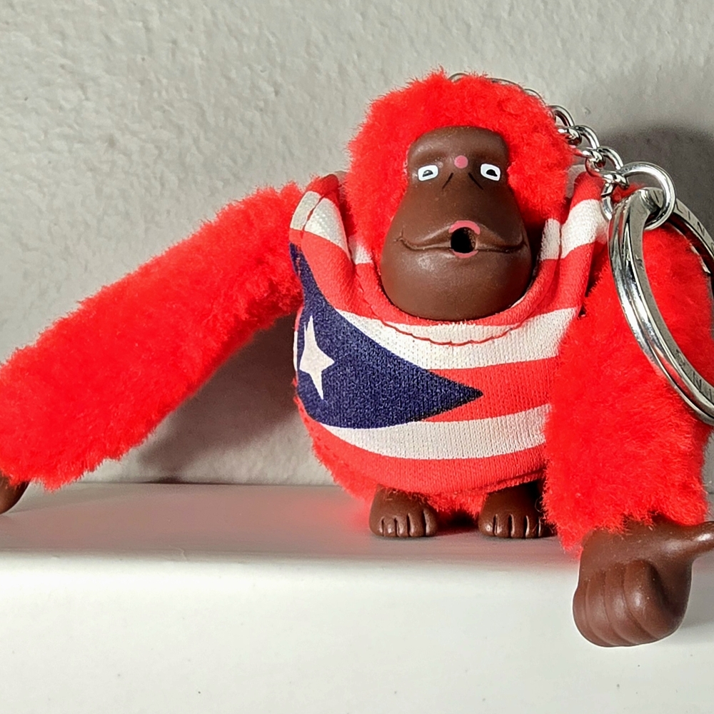 Kipling Red Fuzzy Monkey Keychain with Puerto Rico Flag Shirt